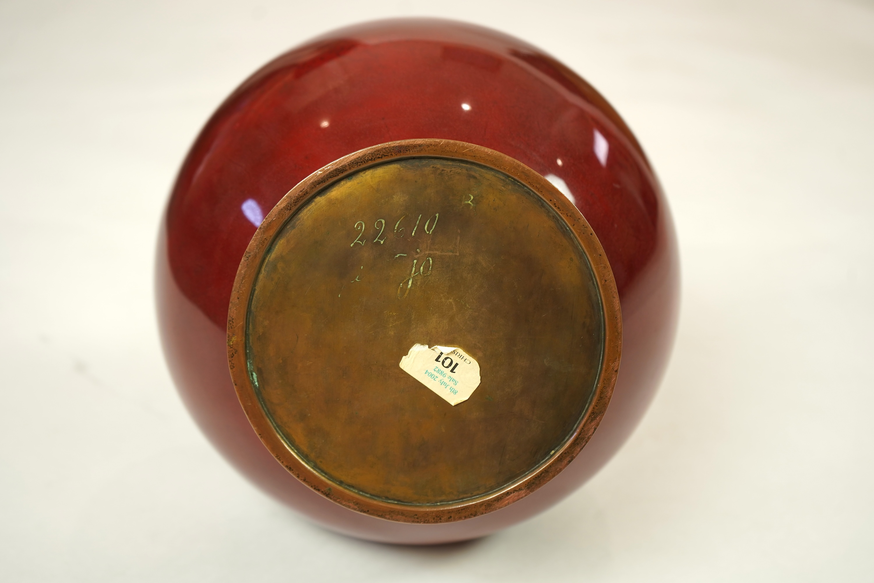 An unusual Japanese sang-de-boeuf ground cloisonné enamel and gilt metal mounted vase